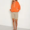 DONNI. Jackets | Knits>Nylon Pullover Papaya/Cream